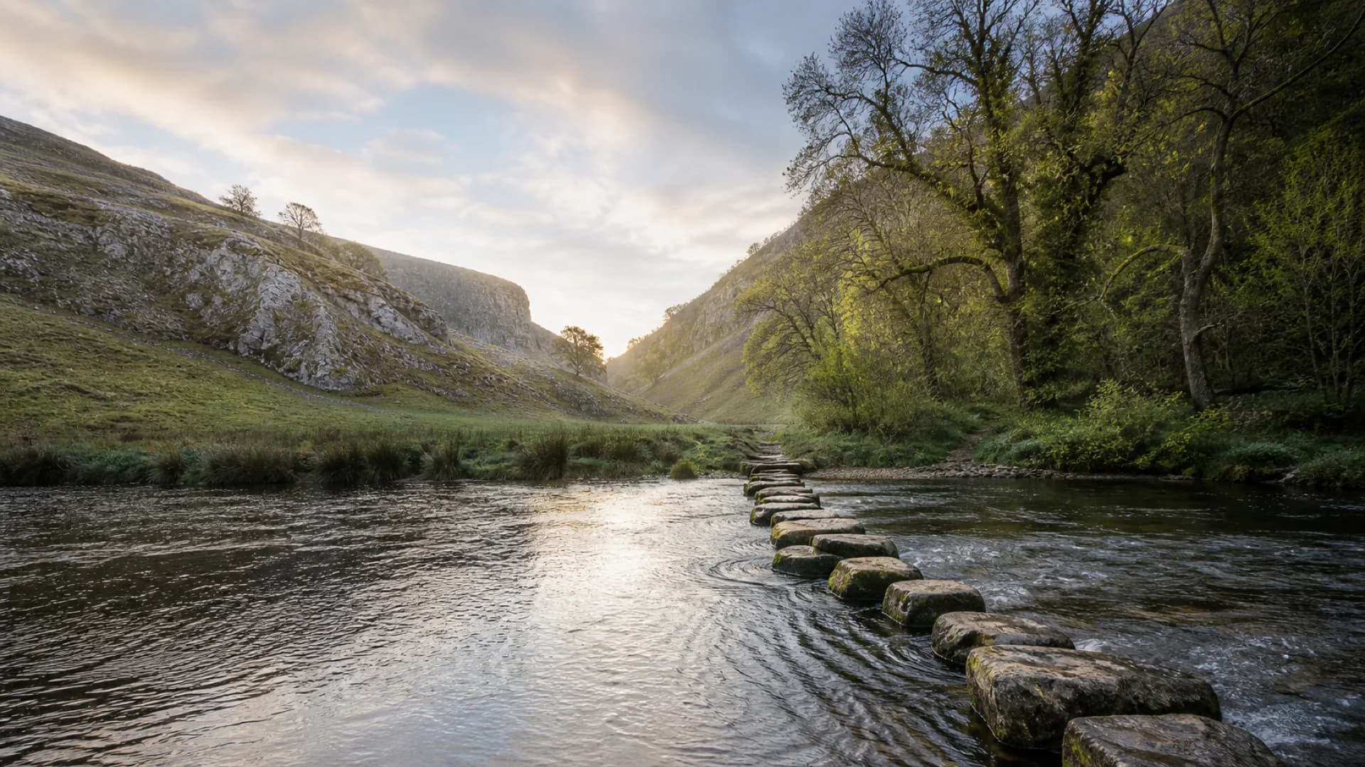 Stepping stones across the River Dove, between the limestone hills of Dovedale